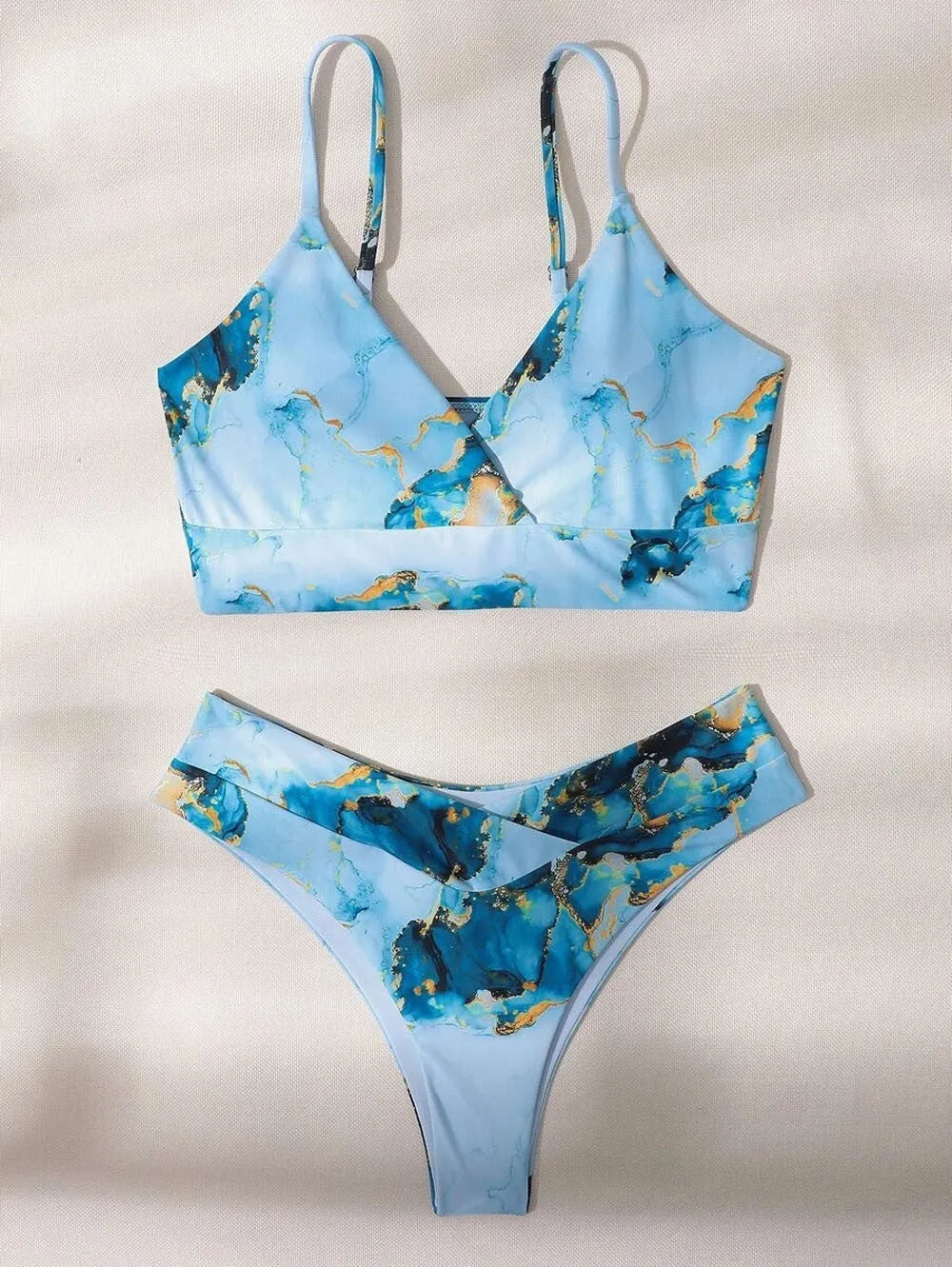 Women's high-waist bikini set with marble tie-dye print and U-neck top.