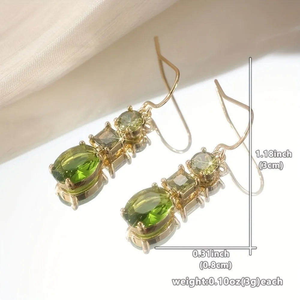 A pair of green geometric copper earrings with a quadrilateral shape in a retro bohemian style.