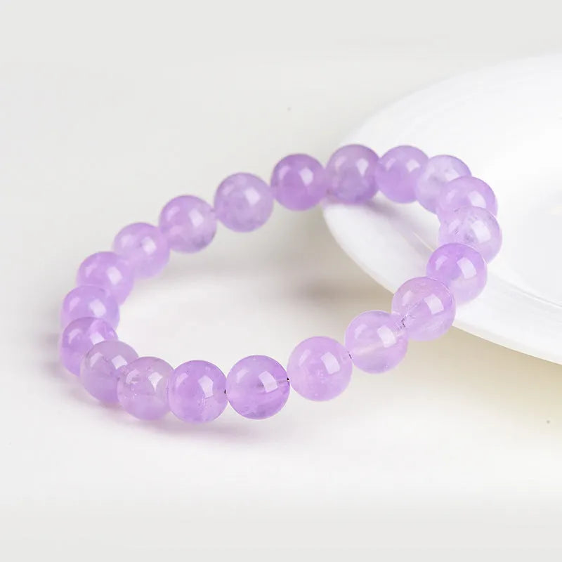 Lavender amethyst crystal bracelet with round beads showing water ripple design in light purple colour