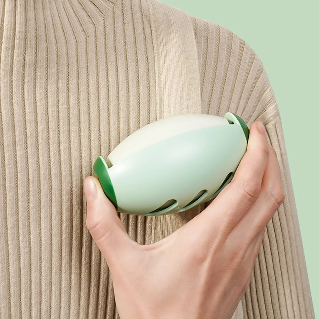 Green and white washable reusable gel lint roller ball for pet hair removal from clothes and furniture