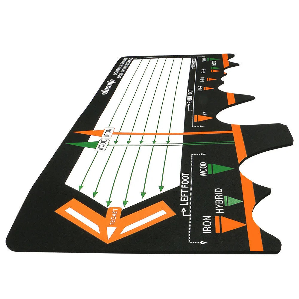 Black neoprene golf swing posture aid mat on grass, showing its compact size and alignment markings.