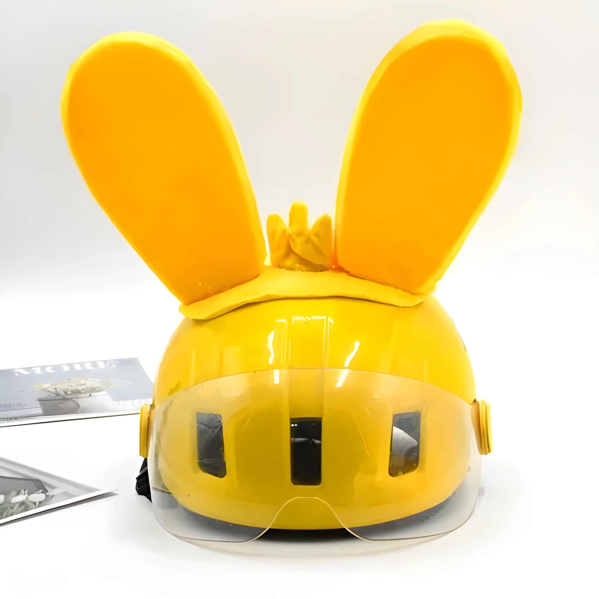 Rabbit Glow Ears helmet decoration with locomotive and ski designs on a Velcro base