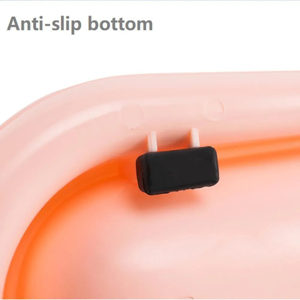 Green double-bowl pet feeder for dog food and water on a floor.