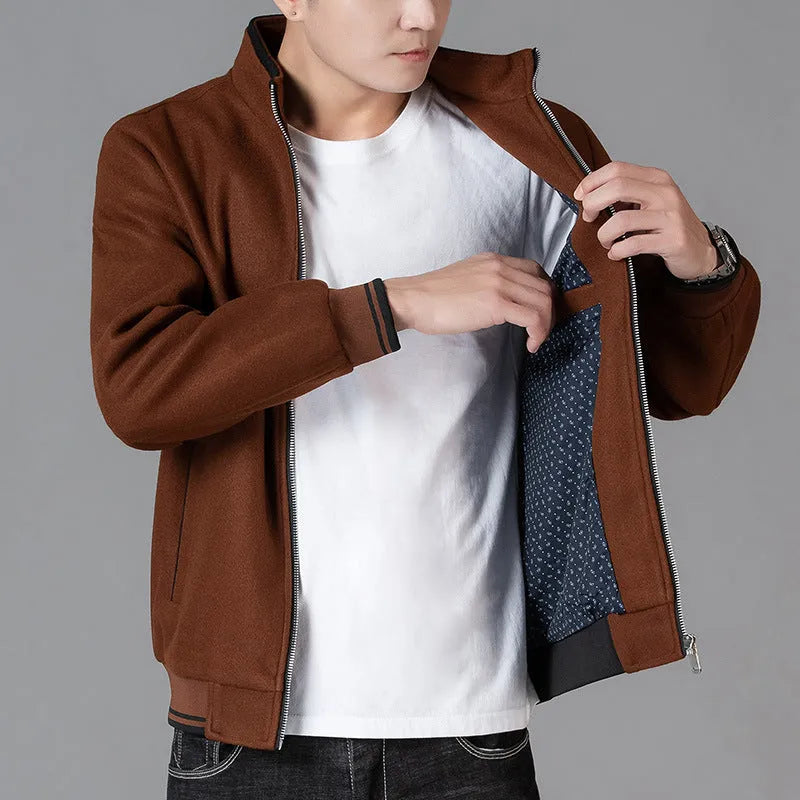 A grey men's sports-style fleece jacket with long sleeves, shown on a hanger.