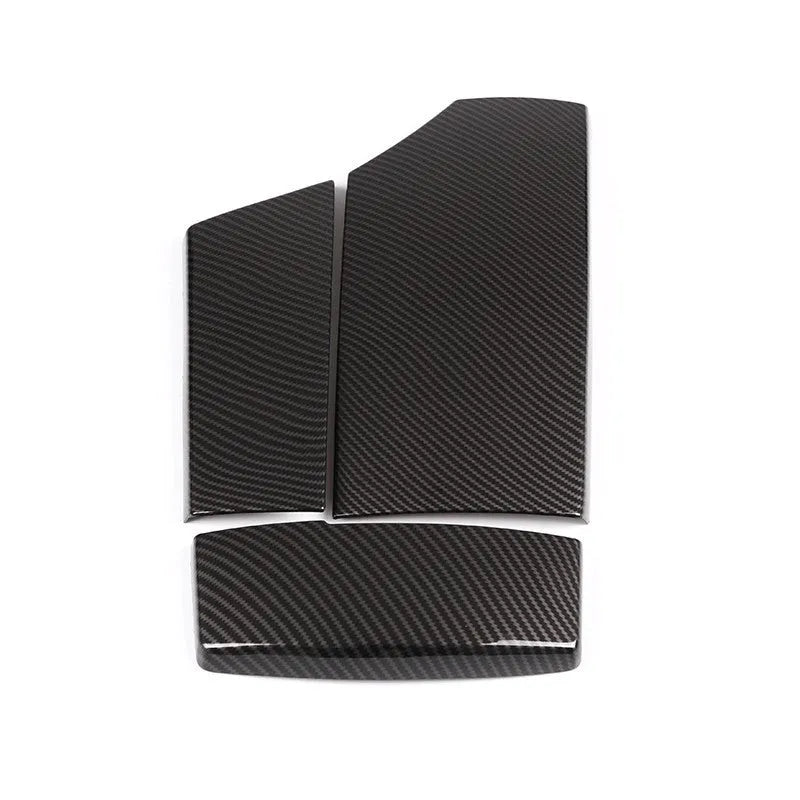 Set of three black ABS plastic armrest box covers with a shiny carbon fibre pattern.