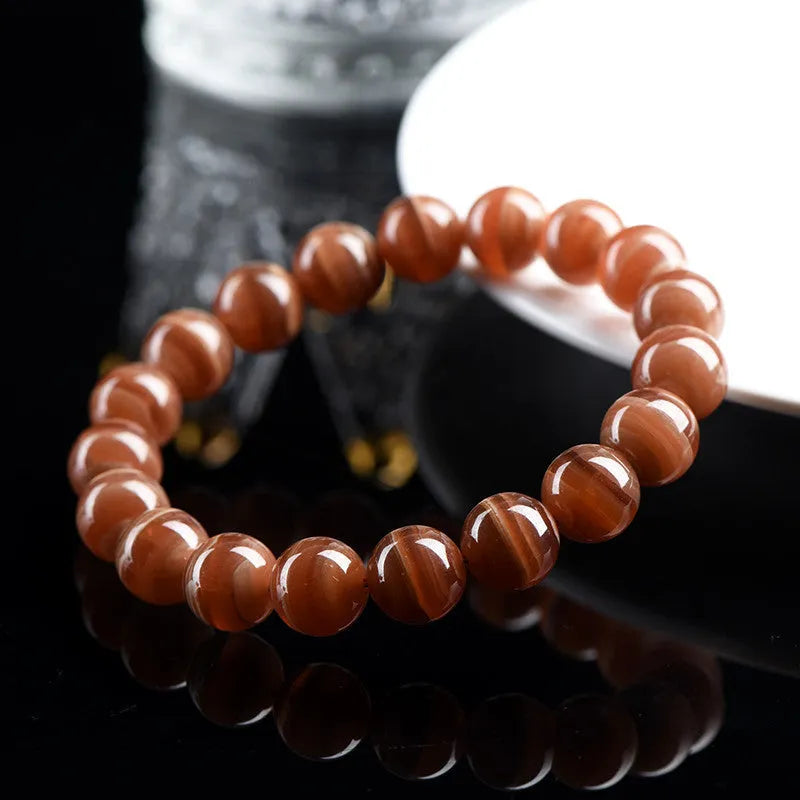 Peruvian Old Mine Rhodochrosite bracelet with geometric design and round beads