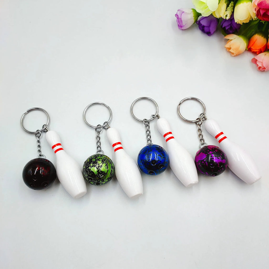 Mini bowling pin simulation keychain pendant in blue colour with metal keyring attachment