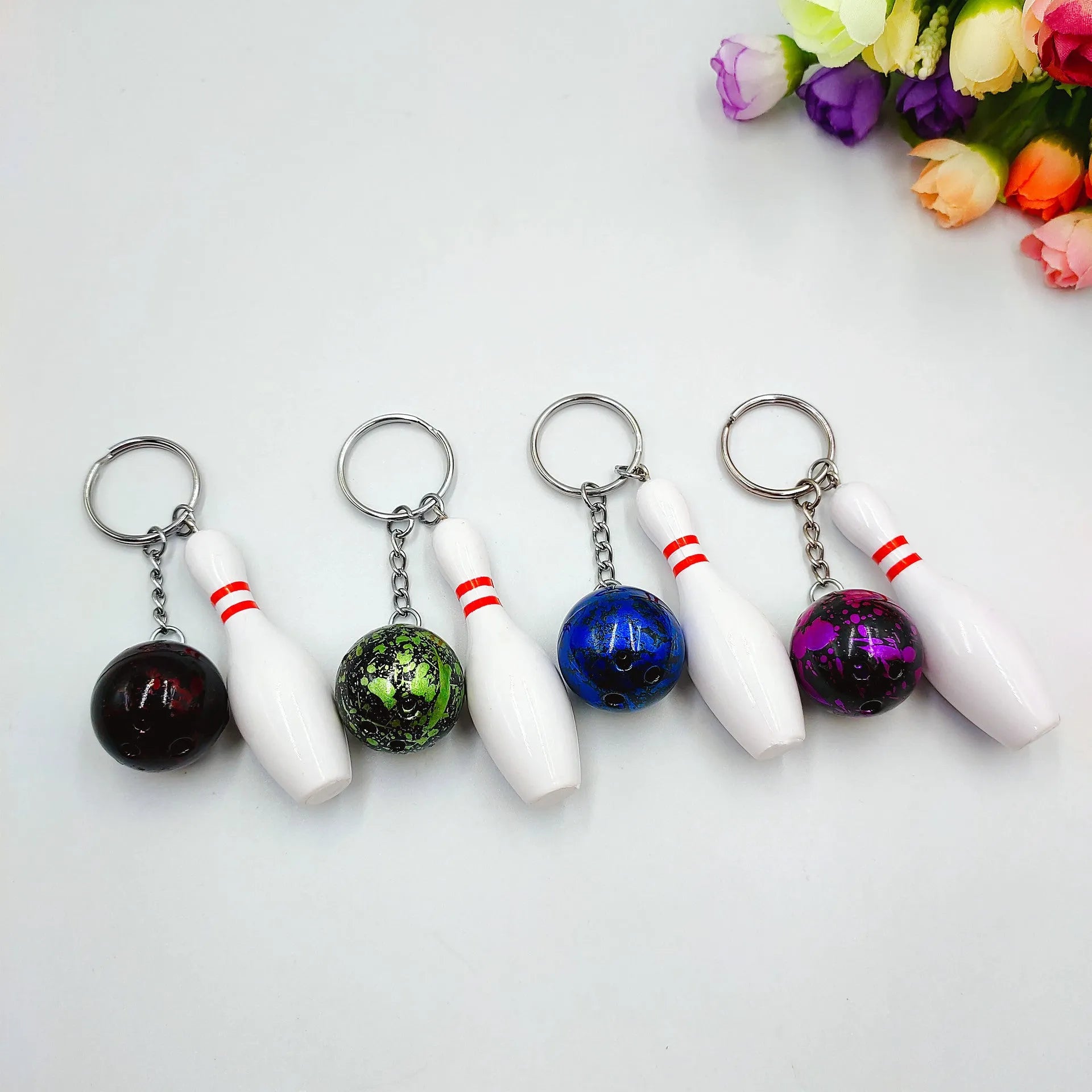 Mini bowling pin simulation keychain pendant in blue colour with metal keyring attachment