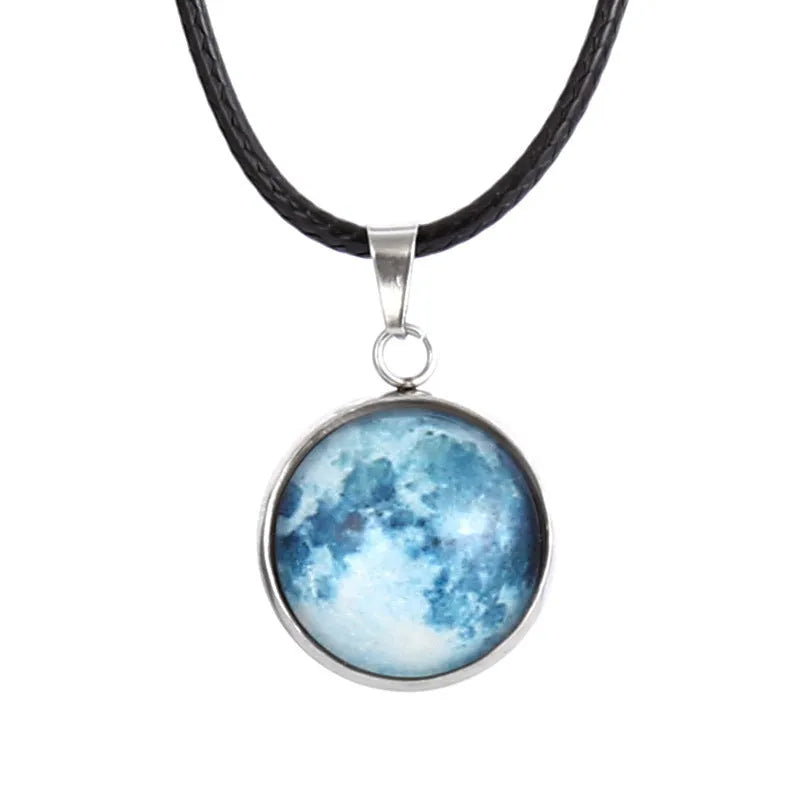 Christmas moon and night sky luminous constellation pendant on a glass necklace chain.
