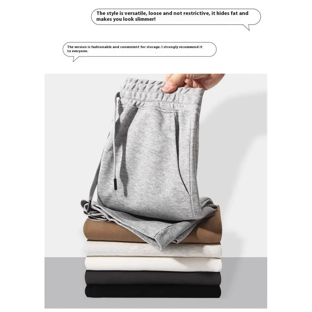 Cotton straight-leg sports shorts in light grey colour showing micro-elastic fabric and fifth pants length