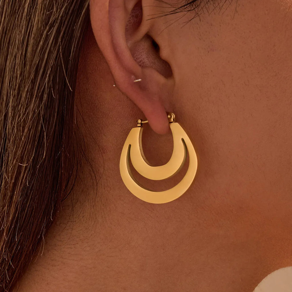 Geometric minimalist French earrings in gold or steel finish with round ring design elements
