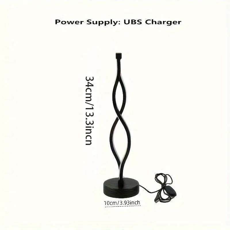 Black aluminum desk lamp with a touch dimming base on a wooden desktop.