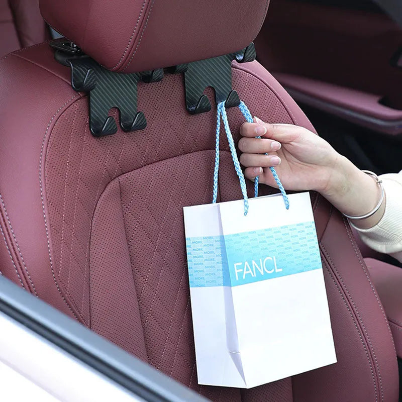 Black ABS car hook bracket with integrated mobile phone holder and storage hooks for rear seat organisation