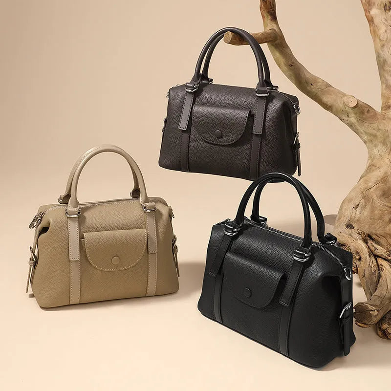 Genuine leather street style handbag for women with adjustable shoulder strap.