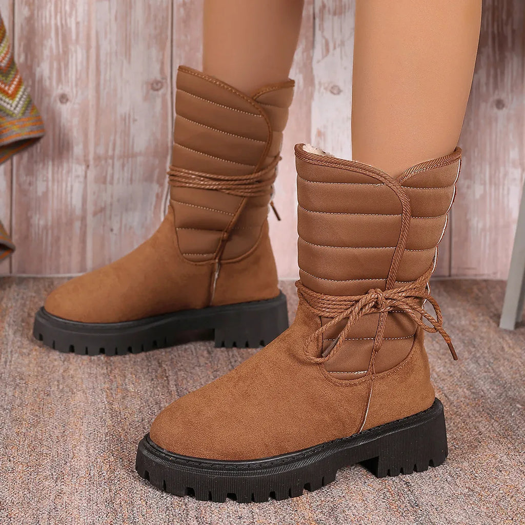 Women's chunky heel snow boots in black with suede upper and lace-up design