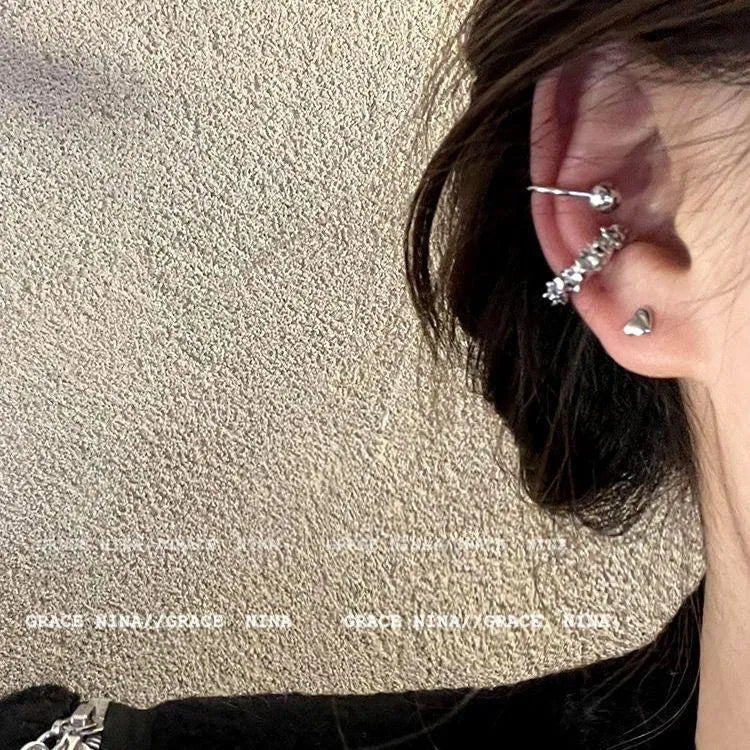 A pair of silver-toned geometric clip-on earrings with an irregular frosty finish and double drop design.