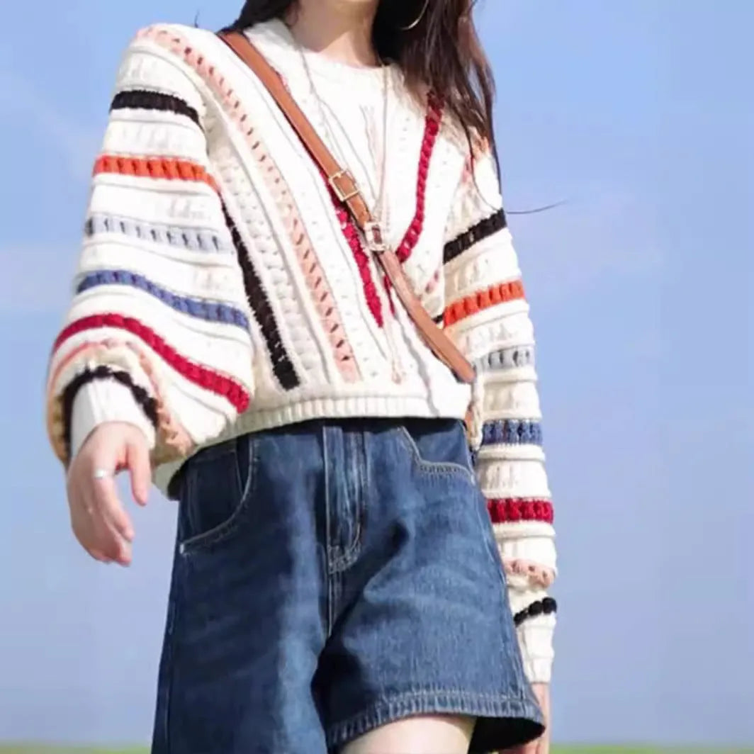 Rainbow striped sweater with batwing sleeves in loose fitting retro casual style