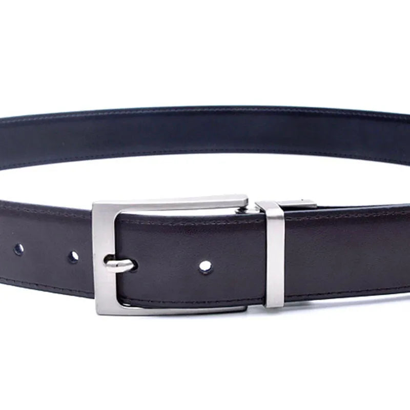 Men's dark brown genuine leather belt with a rotating silver alloy pin buckle on a wooden surface