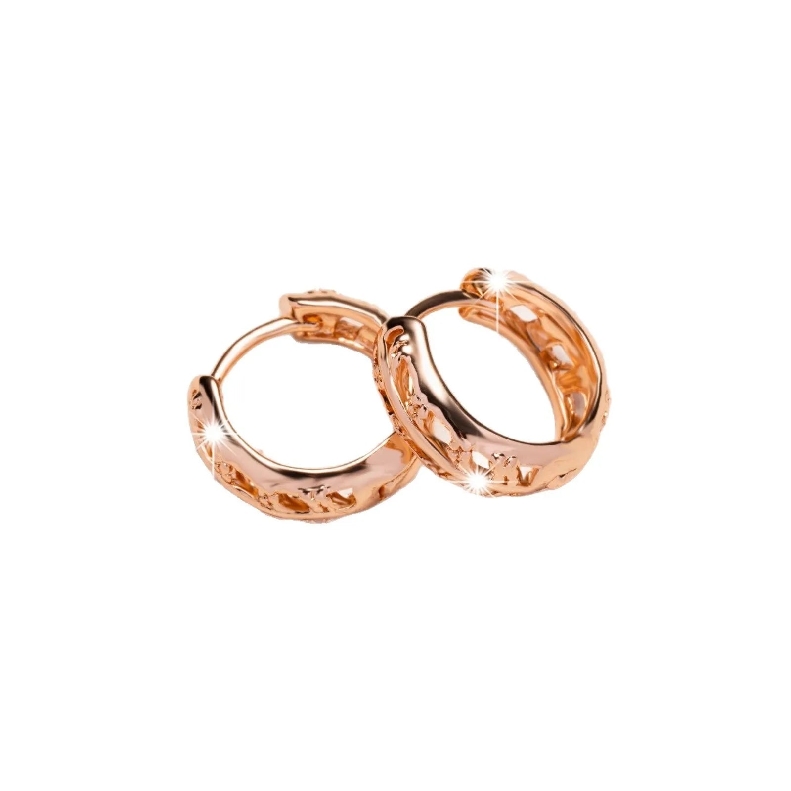 Rose gold copper earrings with hollowed-out heart and leaf designs on white background
