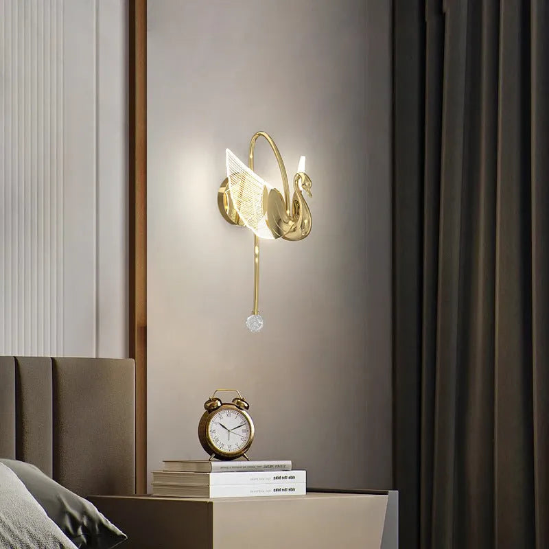 Modern gold swan-shaped wall lamp with acrylic shade and iron body for bedside lighting