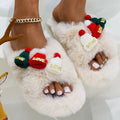 Black Christmas hat design women's slippers with faux plush upper and rubber sole.