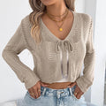 Women's khaki casual coat with hollow-out design detail, shown as a long-sleeve cardigan.