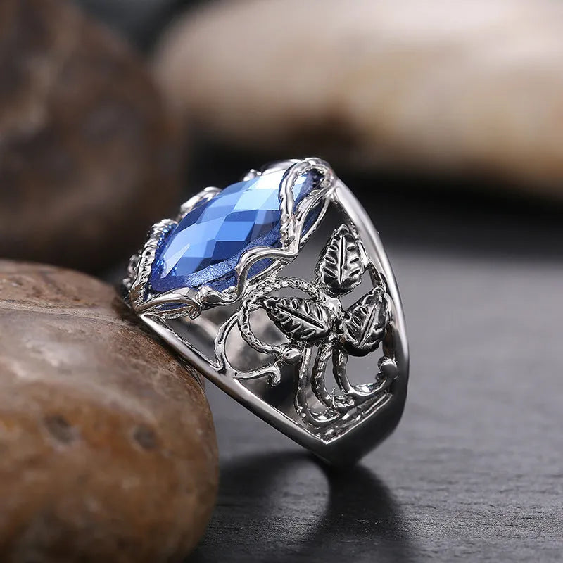 Blue horse eye geometric alloy women's ring with crystal inlay detailing showing side profile