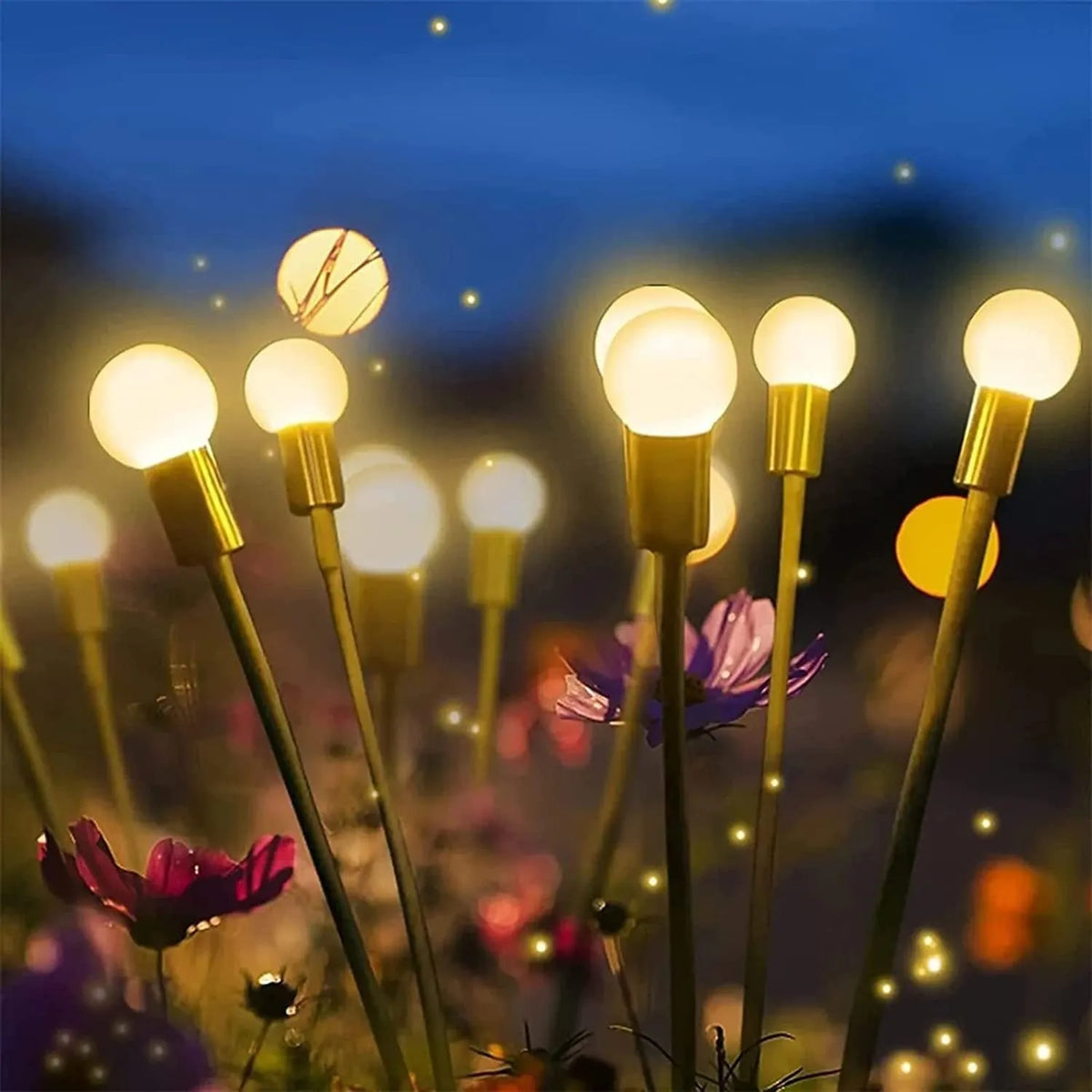 Solar-powered LED ground lamp with multiple heads inserted in garden soil alongside pathway
