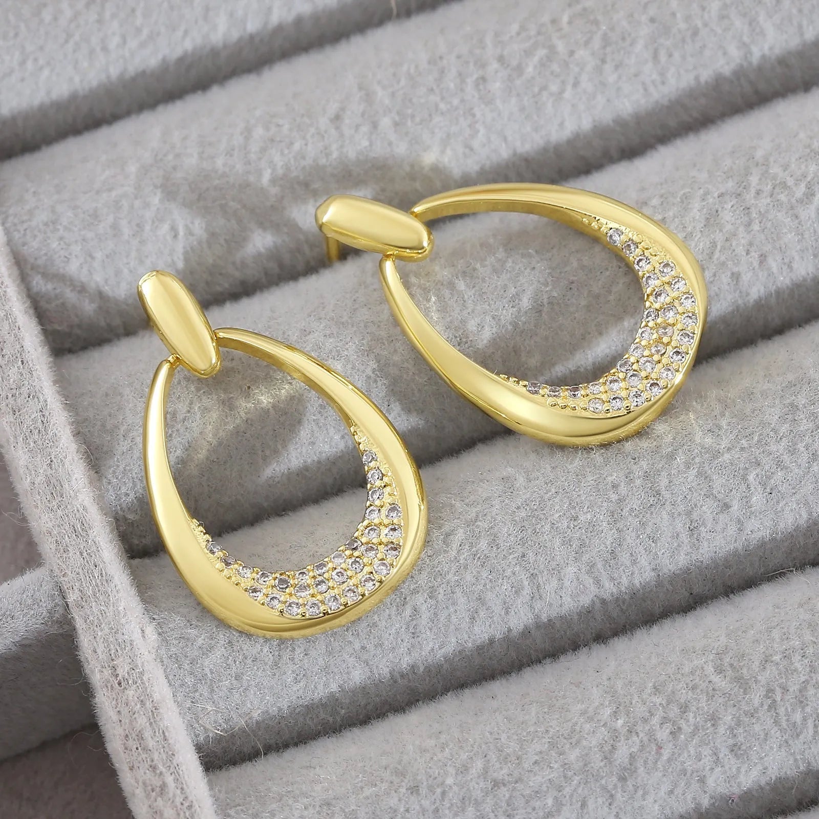 Yellow gold geometric drop earrings with ring design elements measuring 2.6cm