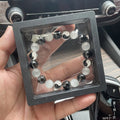 Natural stone Tai Chi bracelet with 10mm polished opal and black agate beads in traditional Chinese beaded design