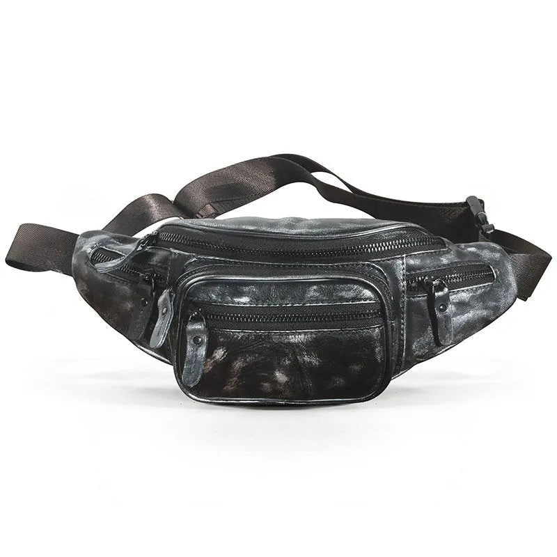 Brown cowhide leather messenger bag with a single shoulder strap, shown closed.