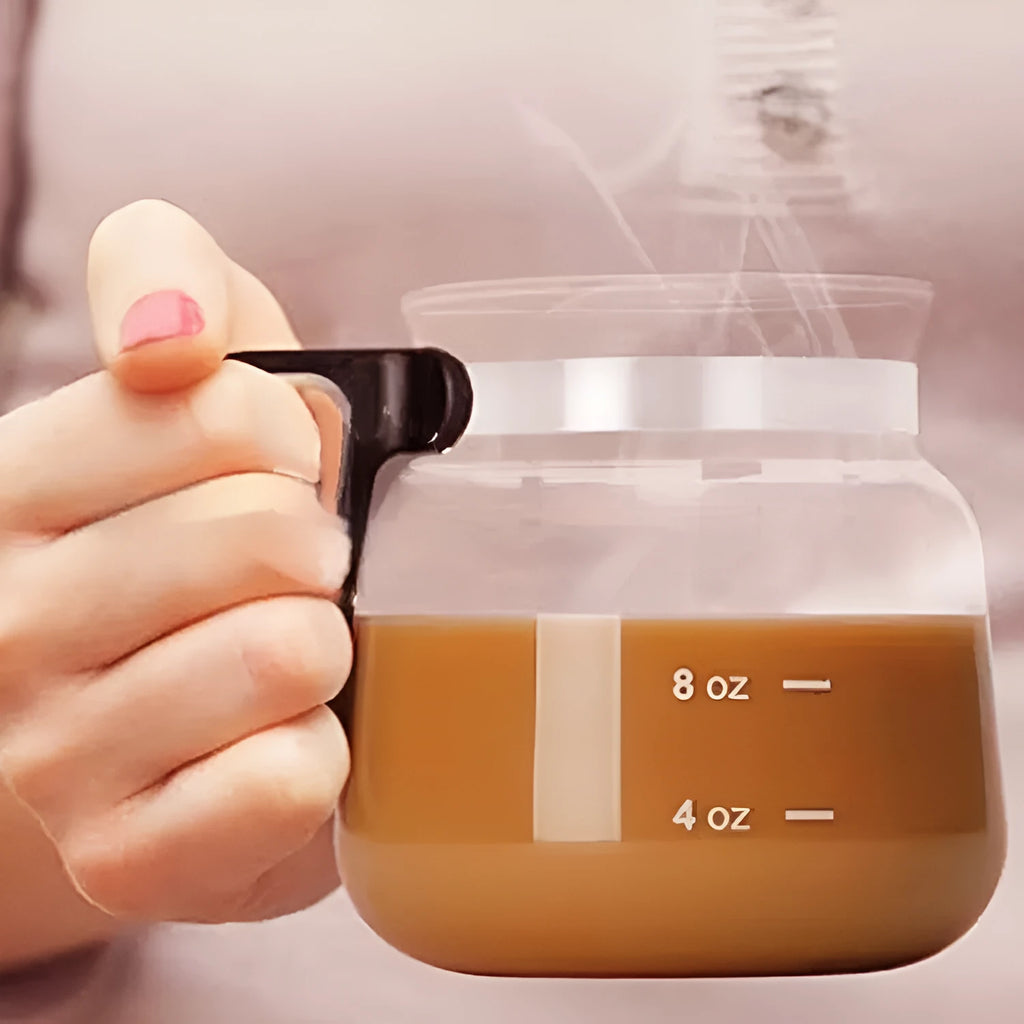 Transparent borosilicate glass coffee maker with silicone lid showing 355ml-473ml capacity markings