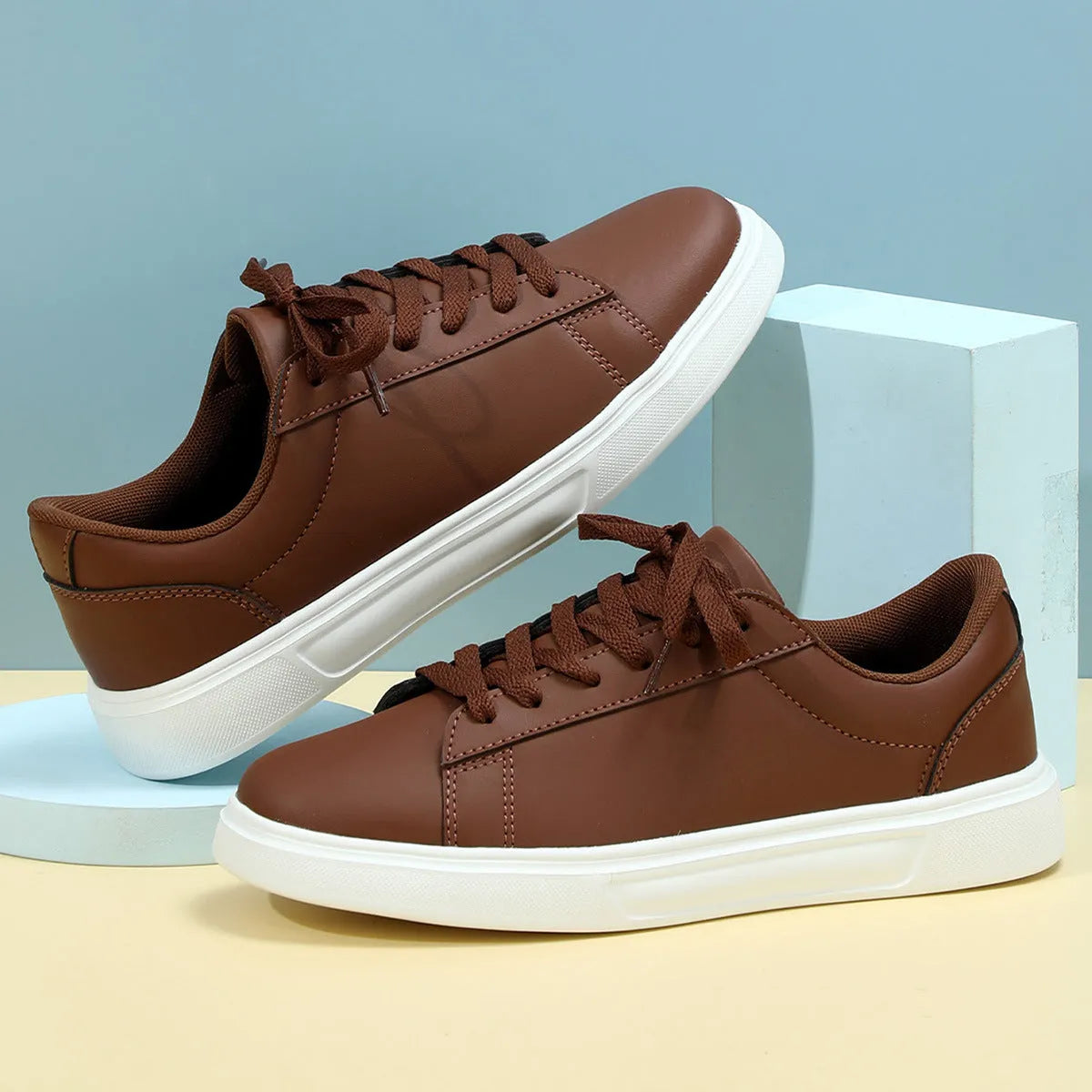Casual platform sneaker with cross strap detail on artificial PU upper in beige brown colour