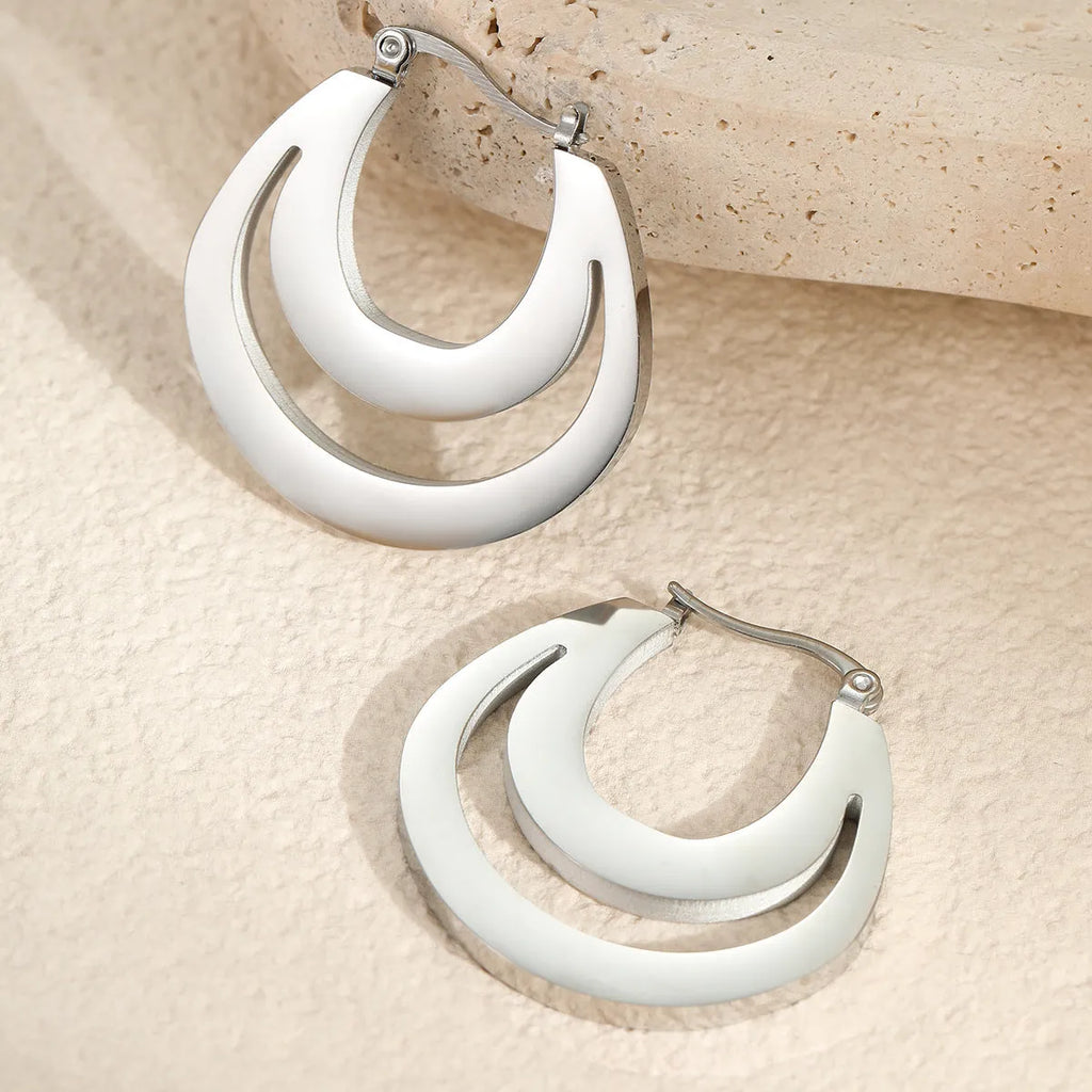 Geometric minimalist French earrings in gold or steel finish with round ring design elements