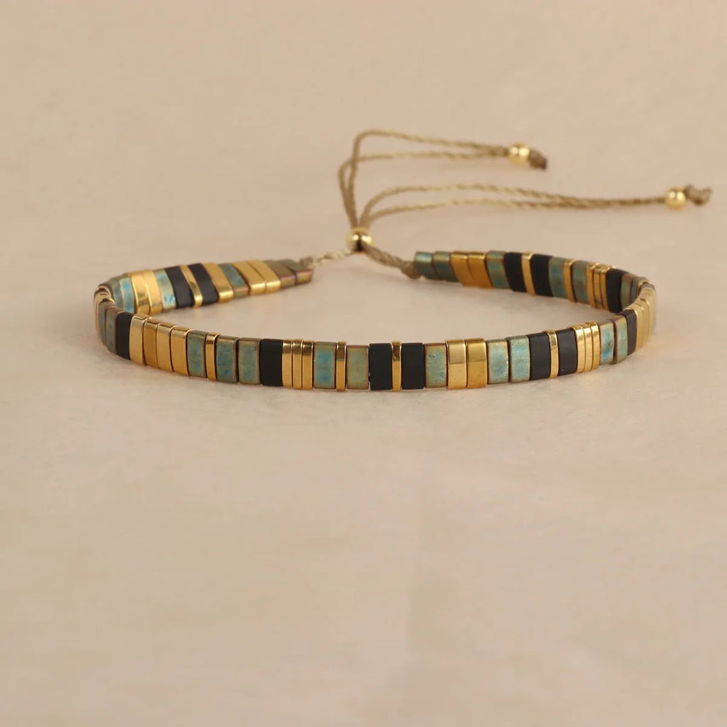 Geometric glass pull bead bracelet in milky white, black, green, blue or red with round decorative elements
