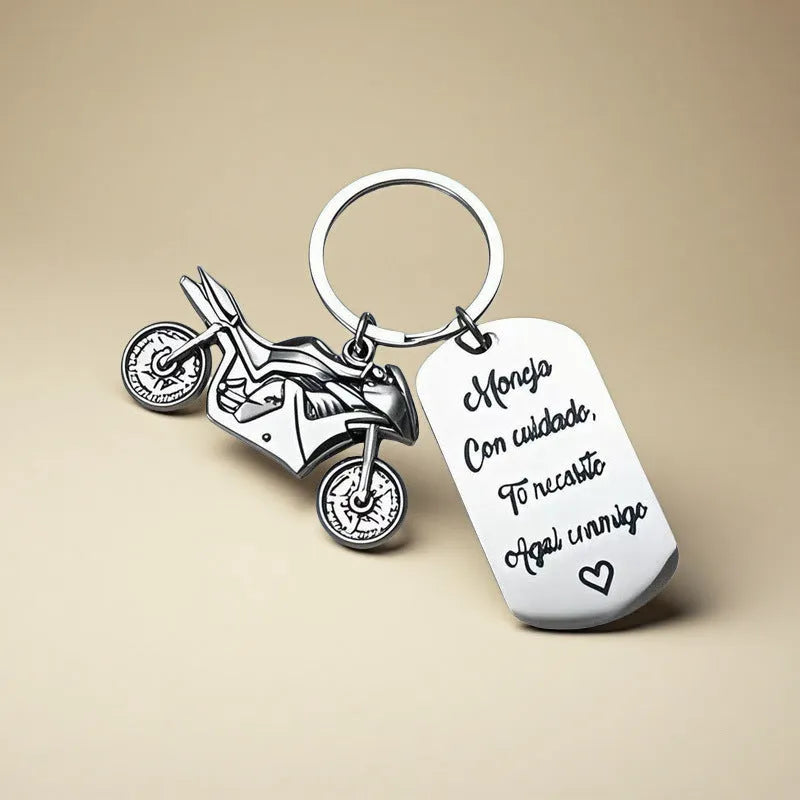 Stainless steel motorcycle keychain with inspirational text and a flannel storage bag.
