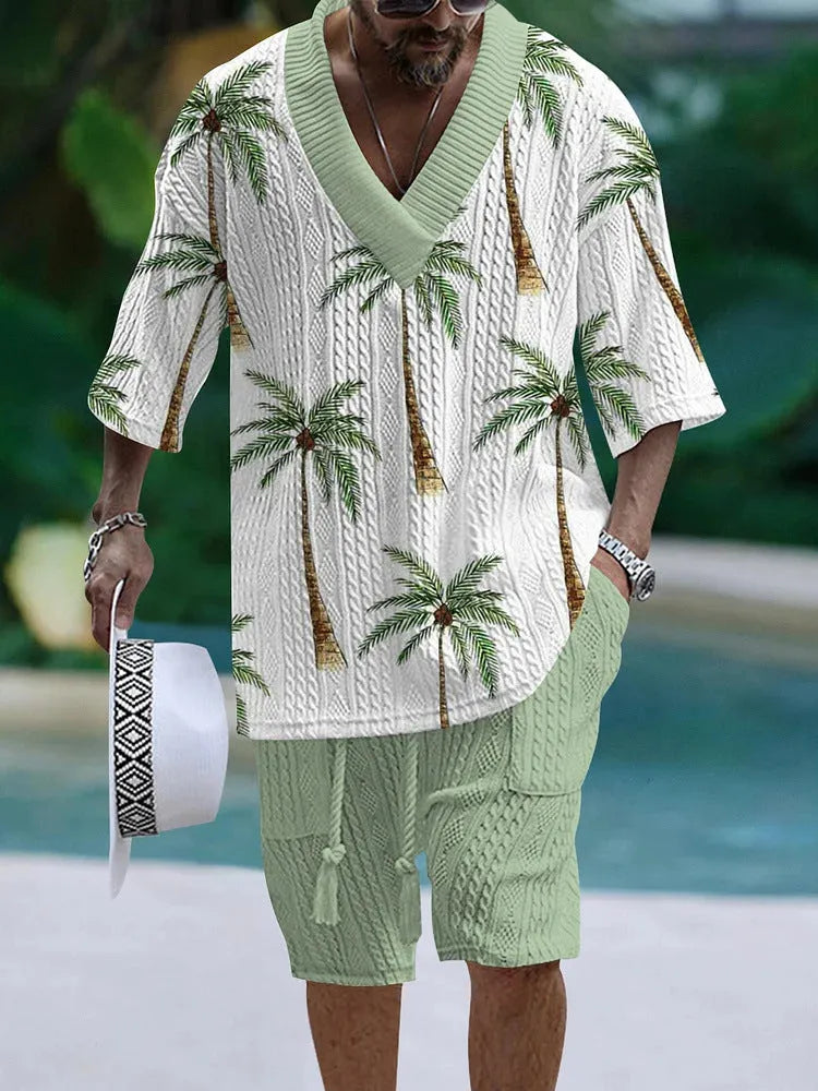 Man wearing a loose-fitting light blue short sleeve top and matching shorts casual suit set.