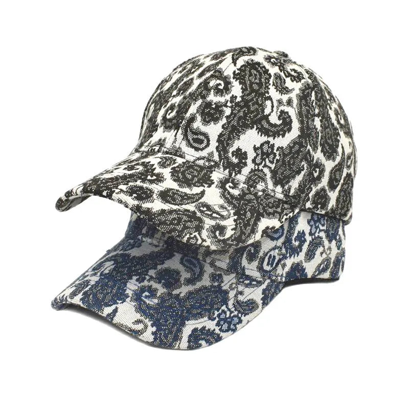 Blue polyester baseball cap with a white paisley pattern print and a dome crown.