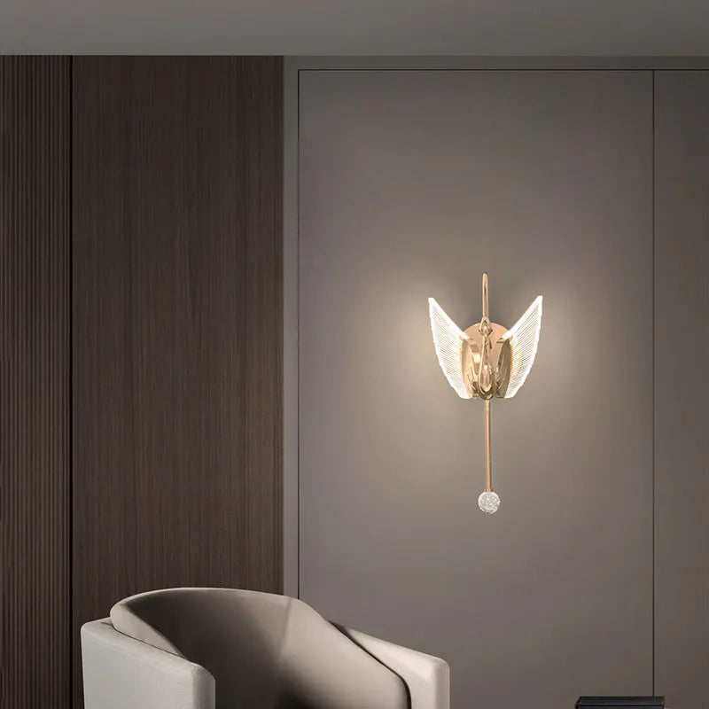 Modern gold swan-shaped wall lamp with acrylic shade and iron body for bedside lighting