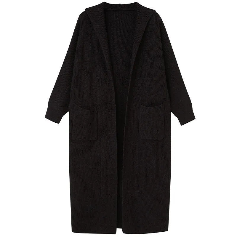 Long grey knitted hooded cardigan coat with a loose fit, shown worn open.