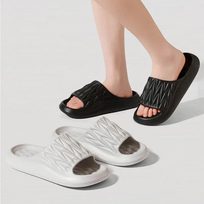 Leaf texture design EVA slippers for men and women in assorted colours on a white background.