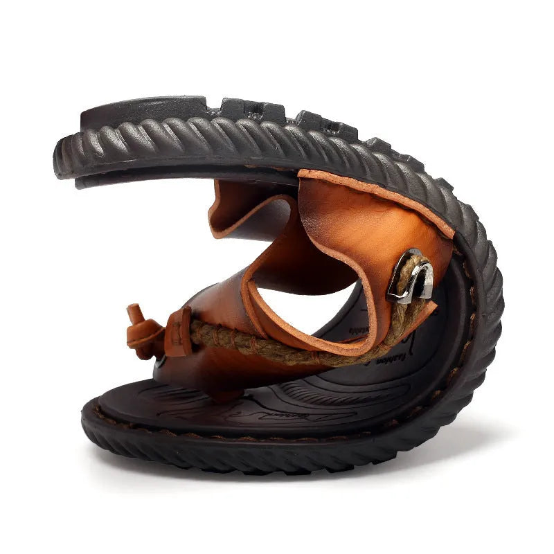 Men's dark blue herringbone pattern outdoor slippers with a leather lining and rubber sole.