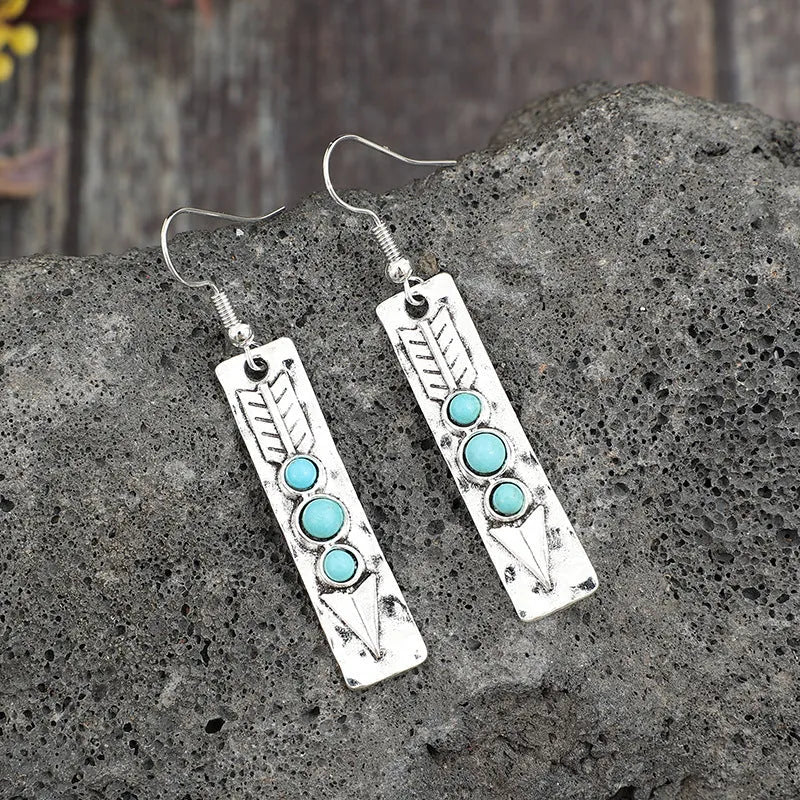 Long strip silver earrings with geometric shape and turquoise colour inlay