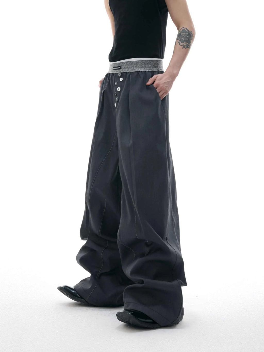 Straight-leg high-waist casual trousers in grey with a button-open line design detail on the leg.