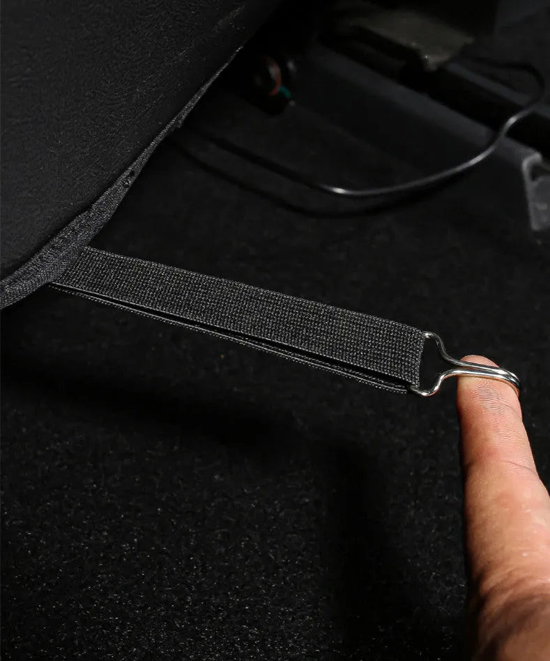 Black leather car rear seat anti-kick protection pad showing full coverage design.