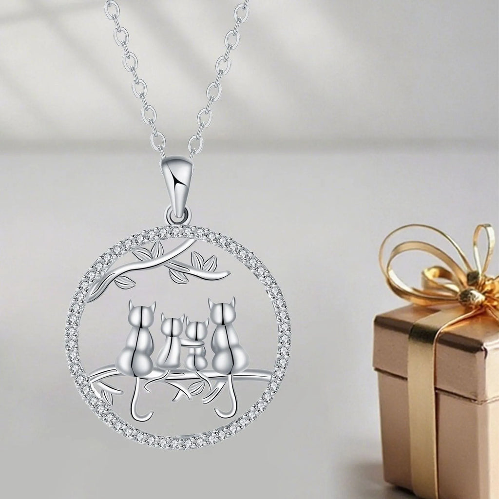 Copper necklace with electroplated four kitten pendant and cross chain.