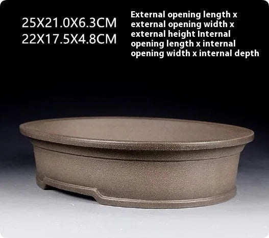 Handmade antique oval purple sand ceramic bonsai pot measuring 25cm long by 21cm wide by 6.3cm high