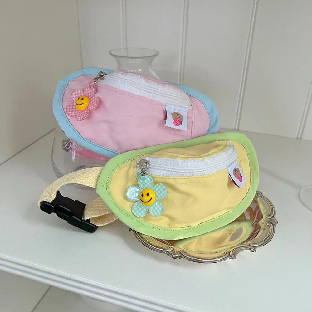 Powder blue, yellow, and green backpack-style poop bag holder for dogs and cats in S and M sizes.