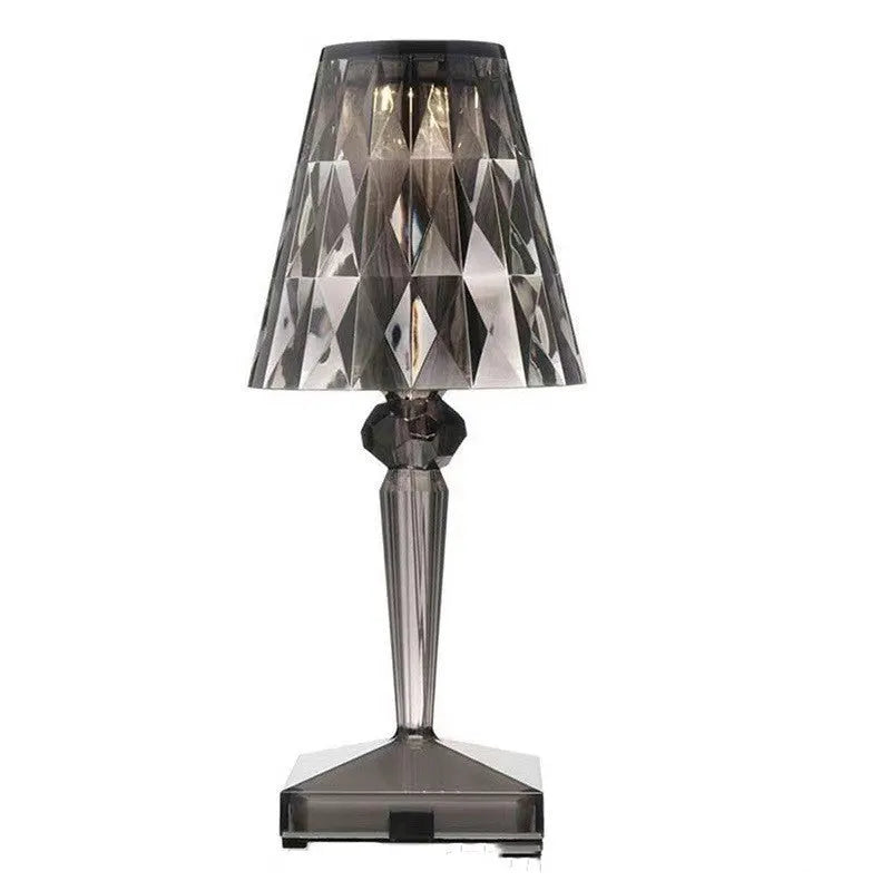 Rose gold portable touch projection night light on a surface showing its acrylic construction and compact size