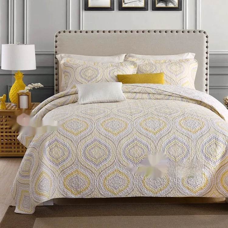 Quilted cotton bed cover set with printed pattern including bedspread and two pillowcases